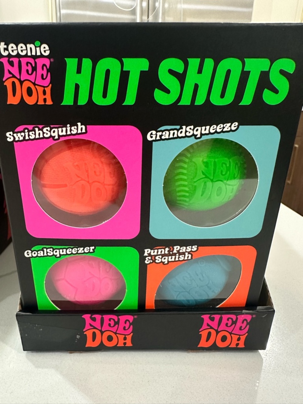 Teenie NeeDoh Hot Shots Squish Ball Set - Neon Orange, Green, Pink, Blue
